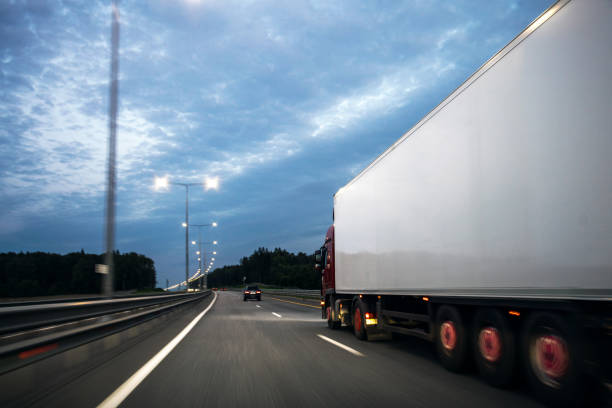 istock Truck on a highway in the evening 1373240391