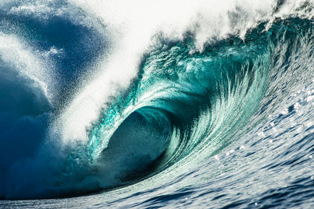 istock Close up detail of powerful teal blue wave breaking on a reef 1373241085