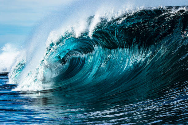 istock Wild unique teal blue wave breaking in open ocean on a bright sunny morning 1373241362