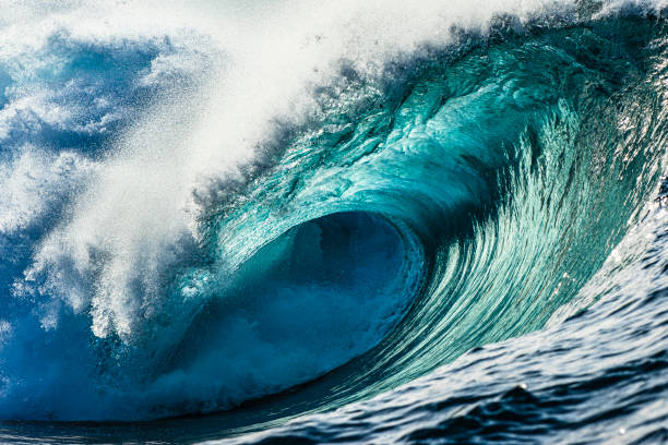 istock Full frame perfect teal blue wave breaking in open ocean on a bright sunny golden afternoon 1373241989