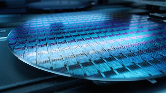 Close up shot of Silicon Wafer During Production at Advanced Semiconductor Foundry, that produces Microchips