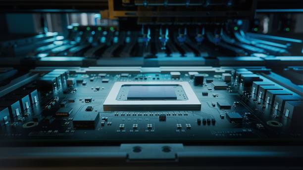 istock Shot of Generic Printed Circuit board with Microchips and other Components During Production Process. Electronics Manufacturing. Dark Environment 1373244204