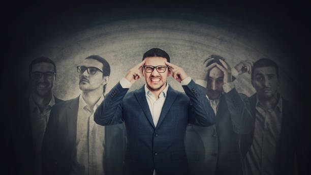 Businessman with multipolar disorder splits emotions into different inner personalities. Mental health concept and schizophrenia psychiatric disease. Dementia panic reactions and mood change Businessman with multipolar disorder splits emotions into different inner personalities. Mental health concept and schizophrenia psychiatric disease. Dementia panic reactions and mood change schizophrenia photos stock pictures, royalty-free photos & images