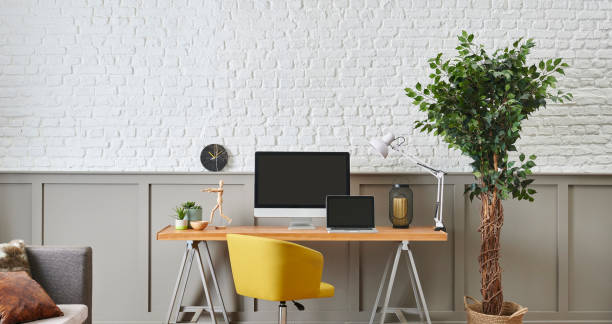 istock Modern working desk and wooden table design, computer and laptop style, home accessory, lamp and chair decor. White brick and brown classic wall background. 1373246068