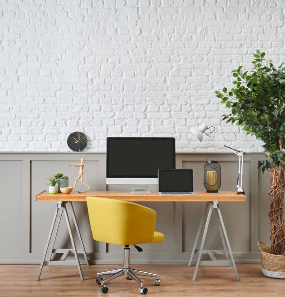 istock Modern working desk and wooden table design, computer and laptop style, home accessory, lamp and chair decor. White brick and brown classic wall background. 1373246070