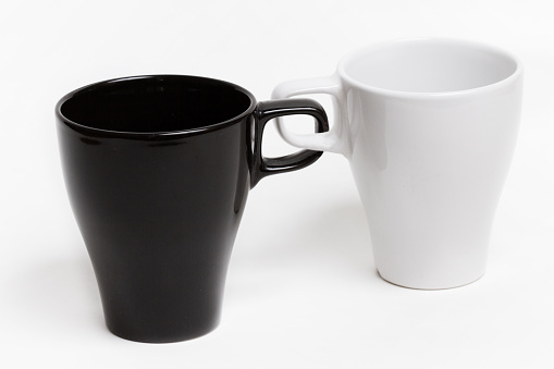 Two mugs linked: forever together bond abstract concept. The mugs handles are irreversibly chained