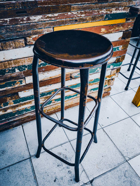 istock Round iron chairs and wooden walls 1373250427