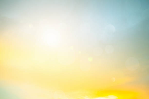 Relaxing outdoors vacation landscape concept: Abstract blurred sunlight beach colorful blurred bokeh background with retro effect autumn sunset sky have blue bright, white, and color orange calm.