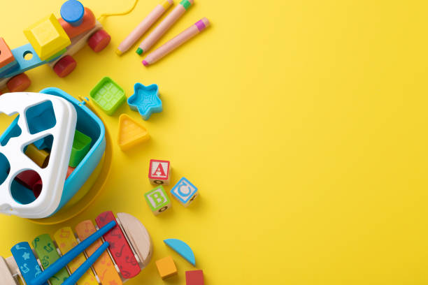 istock Educational toys with copy space on yellow background 1373252473