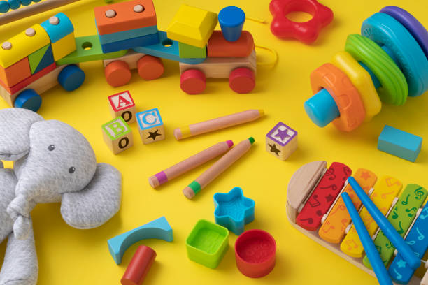 istock Toddler toys with copy space on yellow background 1373252476