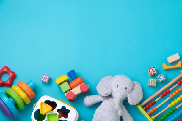 istock Toddler toys with copy space on bluish background 1373252477