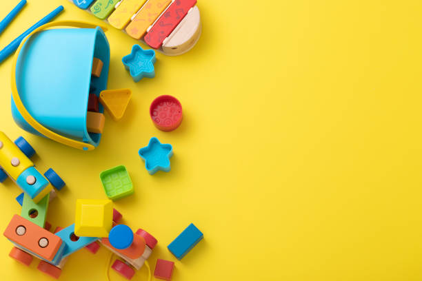 istock Toddler toys with copy space on yellow background 1373252482