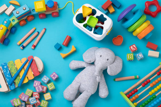 istock Toddler toys with copy space on bluish background 1373252483