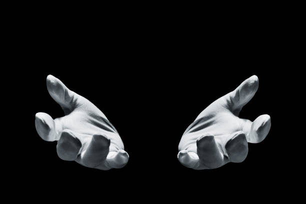 istock Magician hands isolated on black background 1373256481