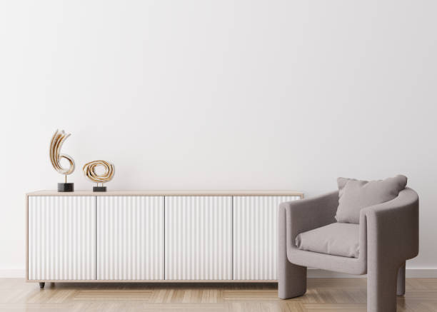 istock Empty white wall in modern living room. Mock up interior in contemporary style. Free space, copy space for your picture, text, or another design. Sideboard, armchair, sculptures. 3D rendering. 1373258022