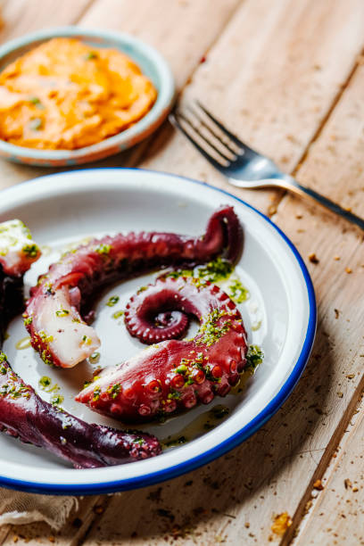 istock cooked octopus and catalan romesco sauce 1373258140