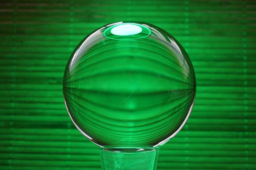 This is a glass ball in modern colors photographed in the studio to be used as a background
