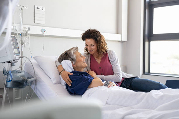 istock Daughter visiting mother in hospital 1373258428