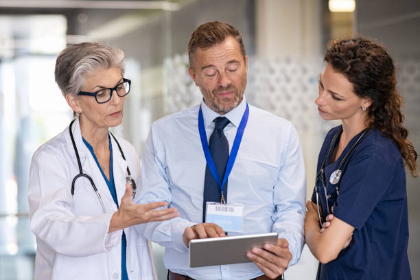 istock Doctor and pharmaceutical agent discussing 1373258975