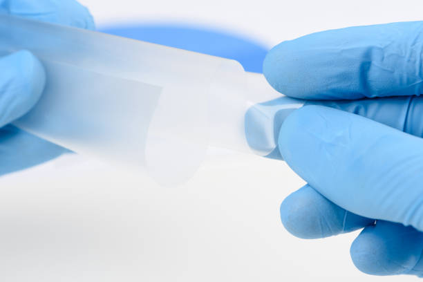 istock Scientist hold and bend flexible transparent thin film material in laboratory 1373259035