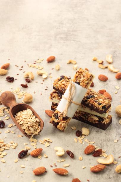 istock Tasty chocolate granola bars on wooden table 1373260265