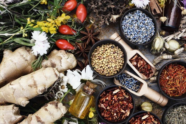 istock Essential oil bottles and medicinal herbs background 1373261418