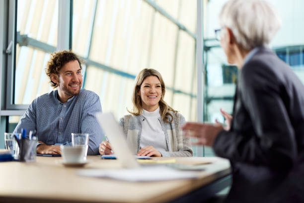 istock Happy colleagues talking on a meeting in the office. 1373263254