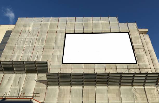 istock Blank information board on the facade under complete refurbishment to improve the energy efficiency building. 1373264453