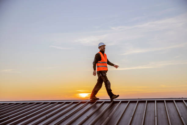 istock A happy construction worker walking on roof on his way to build. 1373264974