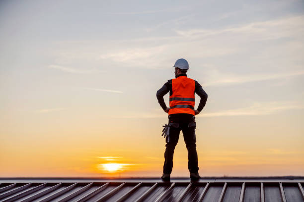 istock A proud construction worker standing on the roof and looking at twilight. 1373265064