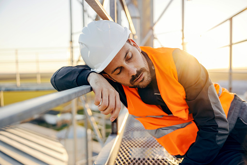 Napping Worker A Tired Industry Worker Taking A Nap On Work Stock Photo - Download ...