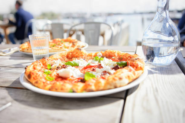 Close-up of a delicious pizza in a restaurant by the sea