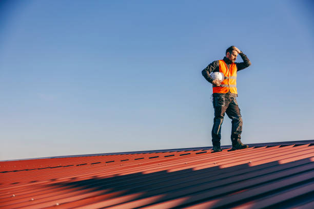 istock A construction worker standing on the roof and having hard times on work. 1373265704