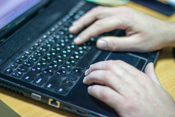 istock Man works on laptop. Blurry photo 1373265786
