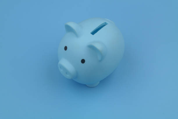 istock Blue piggy bank on blue background. 1373265868