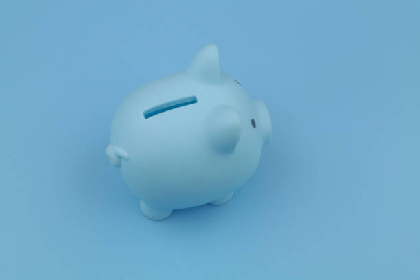 istock Blue piggy bank on blue background. 1373265869