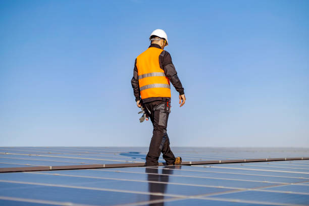 istock A worker on roof on his way to install solar panels. 1373265894