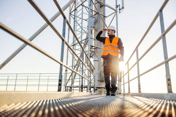 istock An industry worker walking on top of the silo. 1373266003