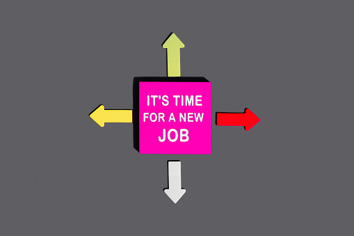 IT'S TIME FOR A NEW JOB - concept of text on sticky note. Pink square sticky note and colorful arrows on grey background, top view
