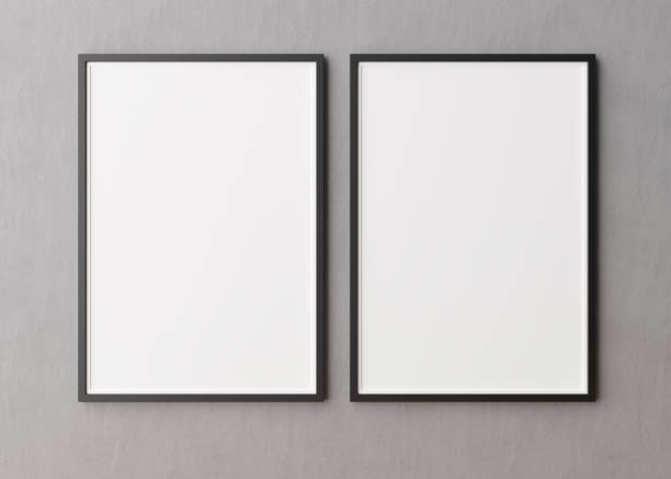 istock Two blank vertical picture frames hanging on concrete wall. Template, mock up for your picture or poster. Copy space. 3D rendering. 1373266341