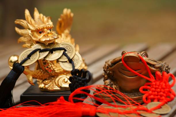 istock A dragon figurine with Chinese coins in its teeth. 1373266872