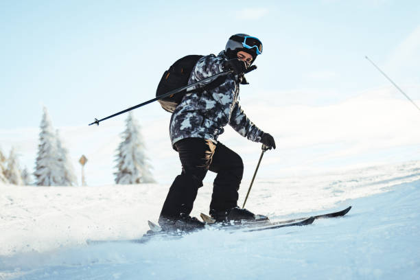 istock The skier is in action and alone with powder behind him. 1373267439