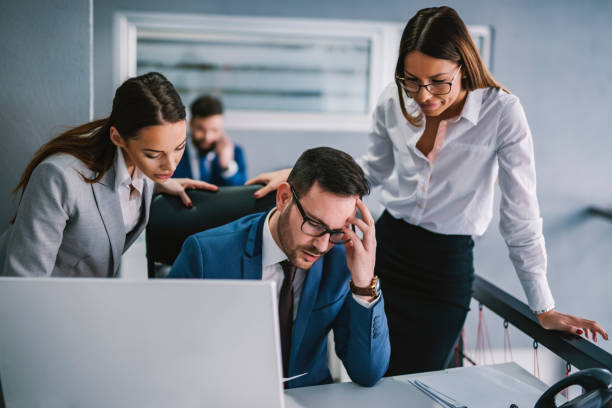 istock Group of businesspeople having troubles with paperwork at office. 1373267554