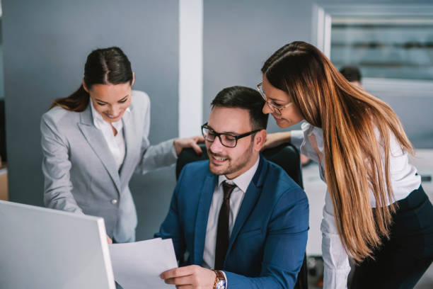 istock Group of businesspeople working on solution at modern office. 1373267572