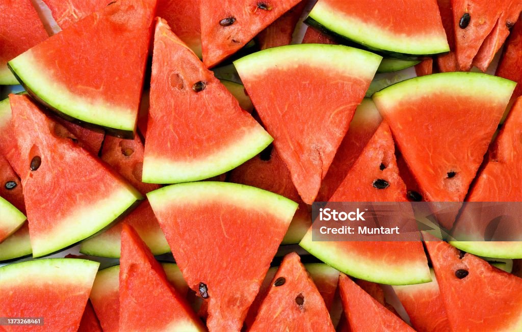 watermelons Multiple pieces of watermelon cut in the shape of a triangle, in an intense red tone Watermelon Stock Photo