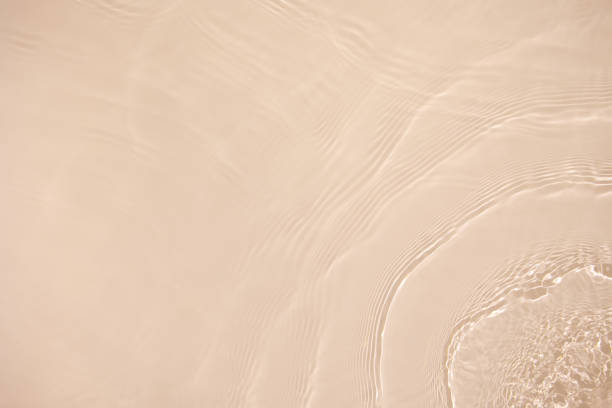 istock transparent beige colored clear calm water surface texture 1373269181