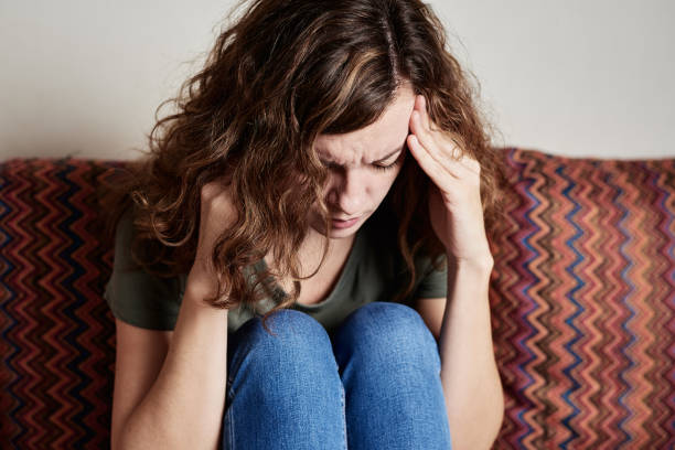 istock Woman suffering from head pain, feeling strong headache 1373269778