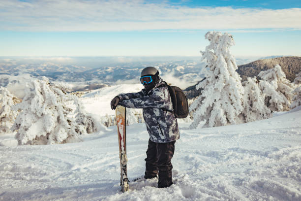 istock Man on mountain with winter clothes 1373269870