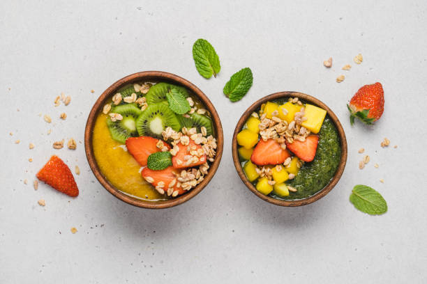 istock Kiwi and mango smoothie wooden bowls 1373273122