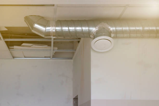 istock workers installers make a ventilation system indoors under the ceiling, the front and background are blurred with a bokeh effect 1373273326